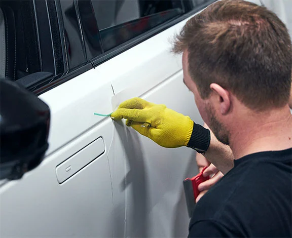 Installer applying vinyl wrap